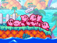 gif from kirby mass attack. multiple kirbies stacked ontop of eachother by the water.